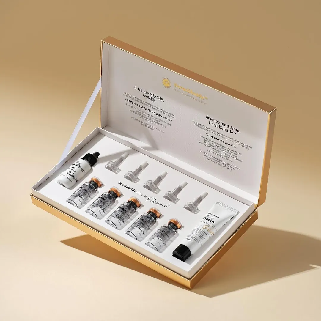 Gold and cream rigid presentation box holding six 3ml vials with dropper caps in a fitted tray