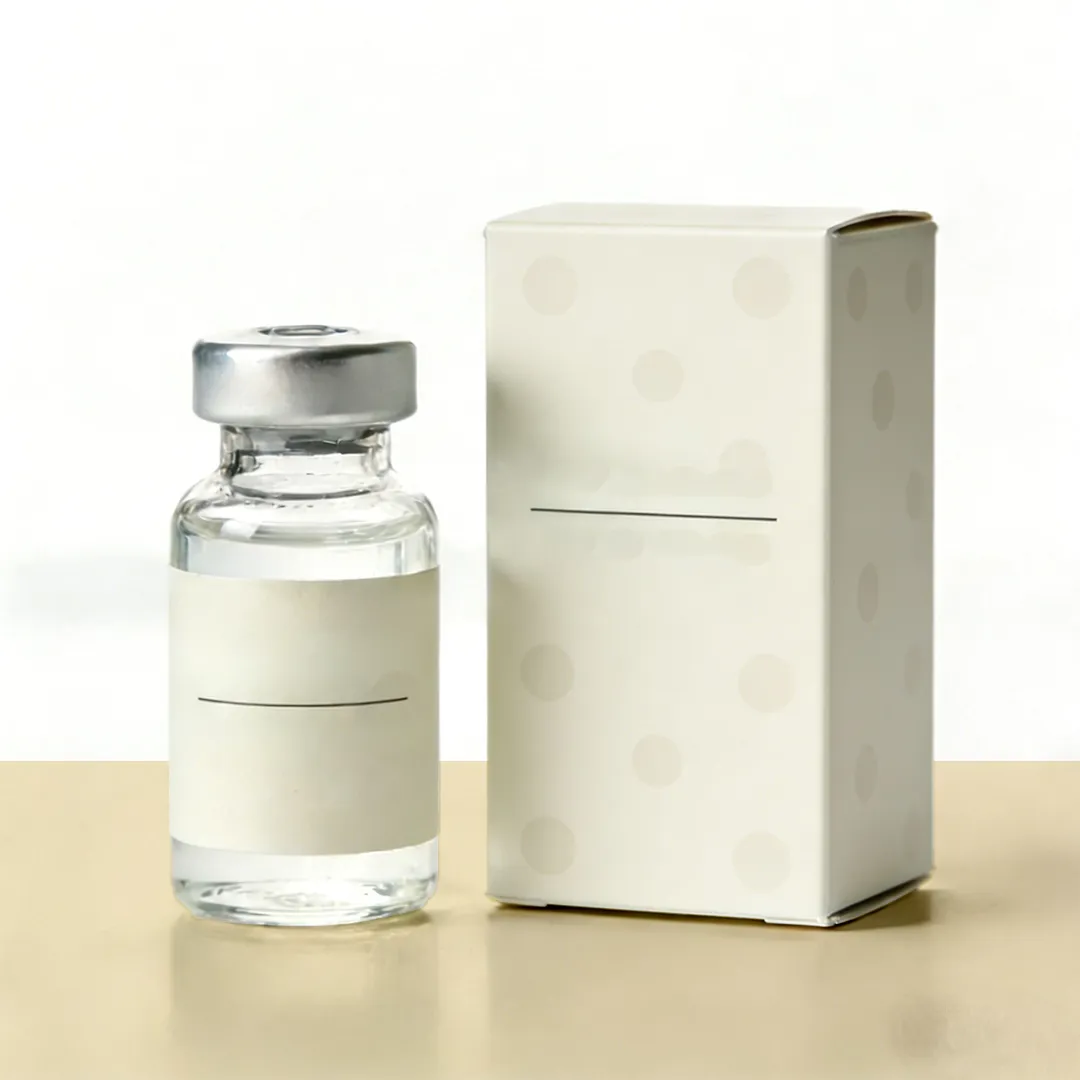 Plain cream carton standing beside a clear glass vial with a silver crimp seal