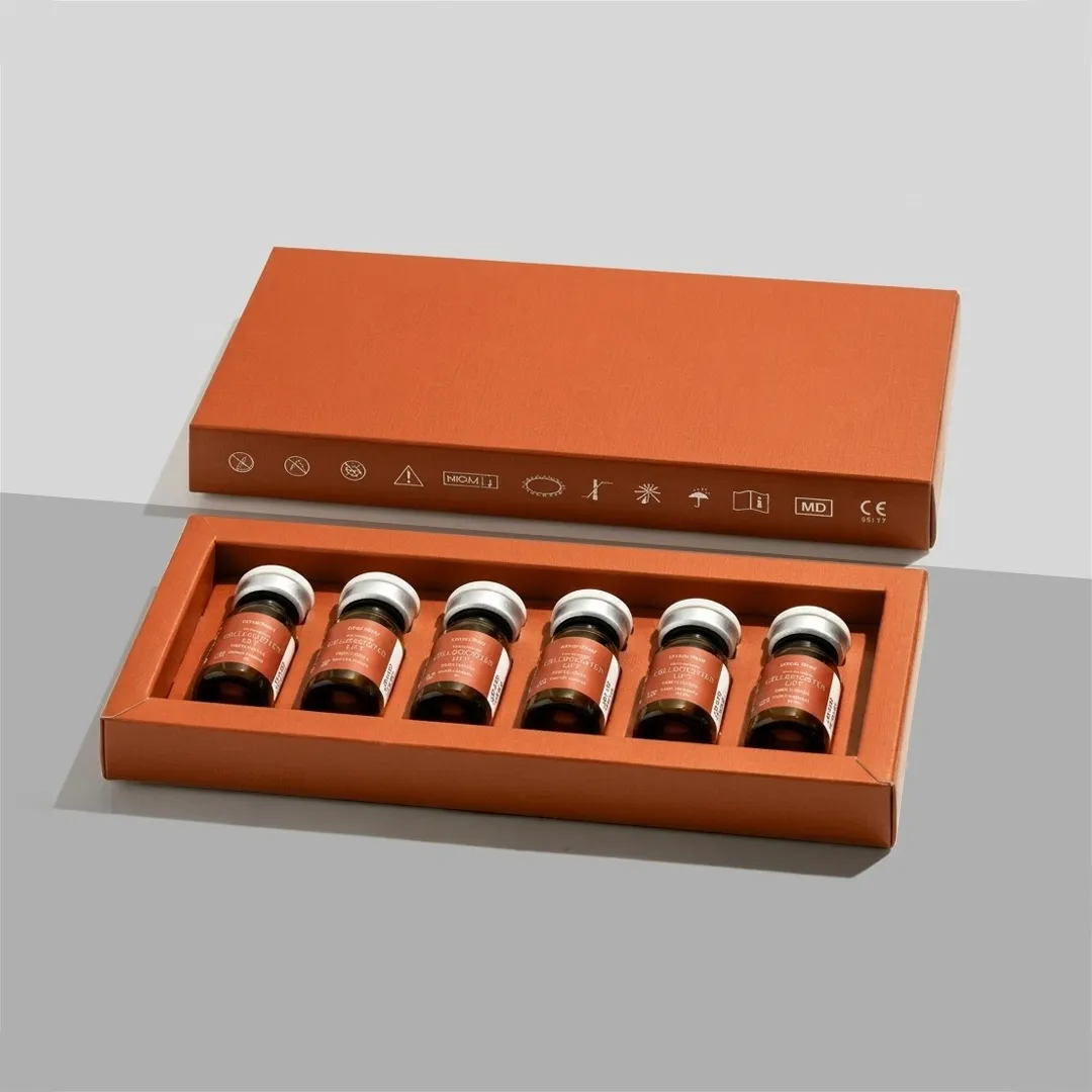 Orange tray insert holding six sealed vials inside a slim lidded box, viewed from above