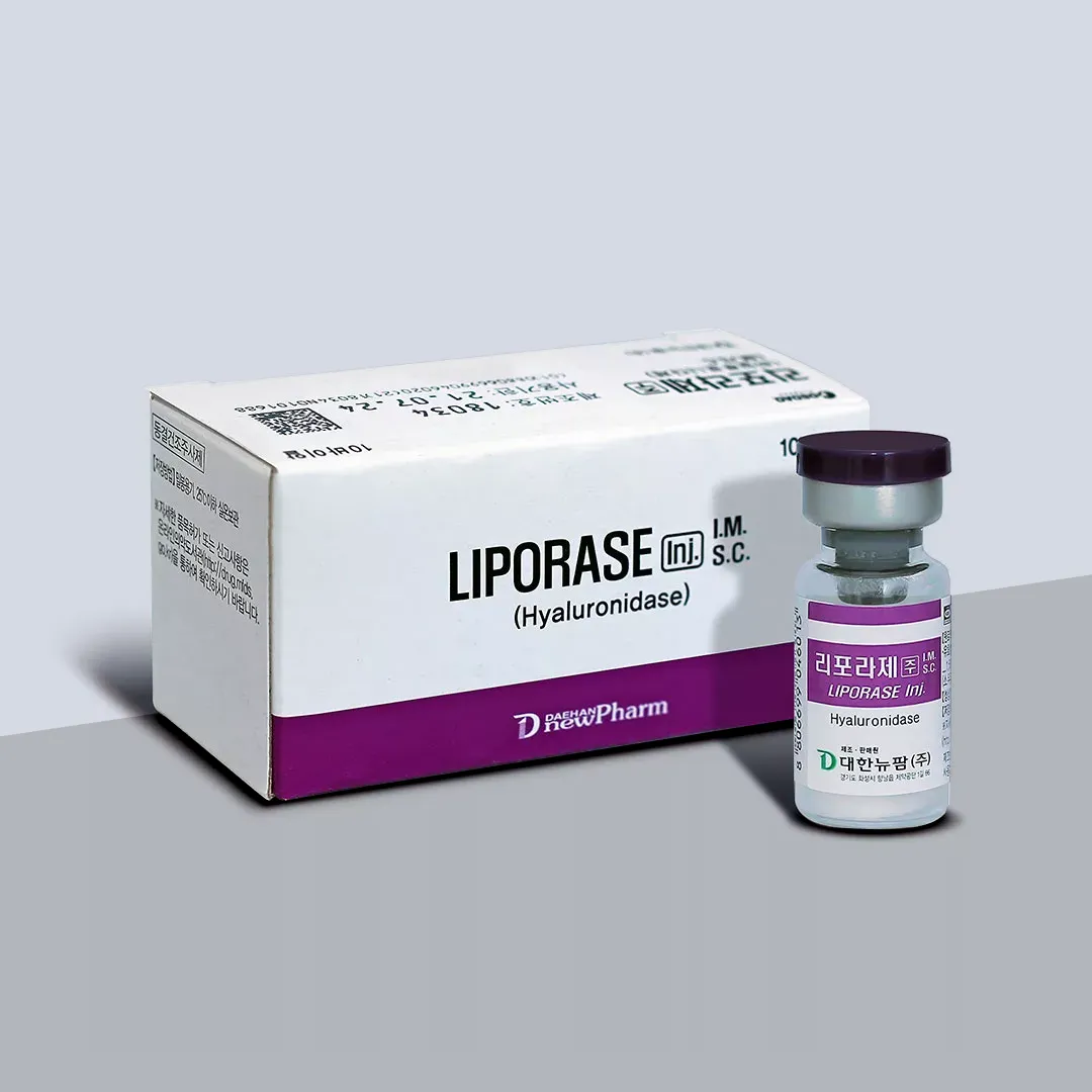 Flat white carton lying beside a small labelled vial with a dark cap