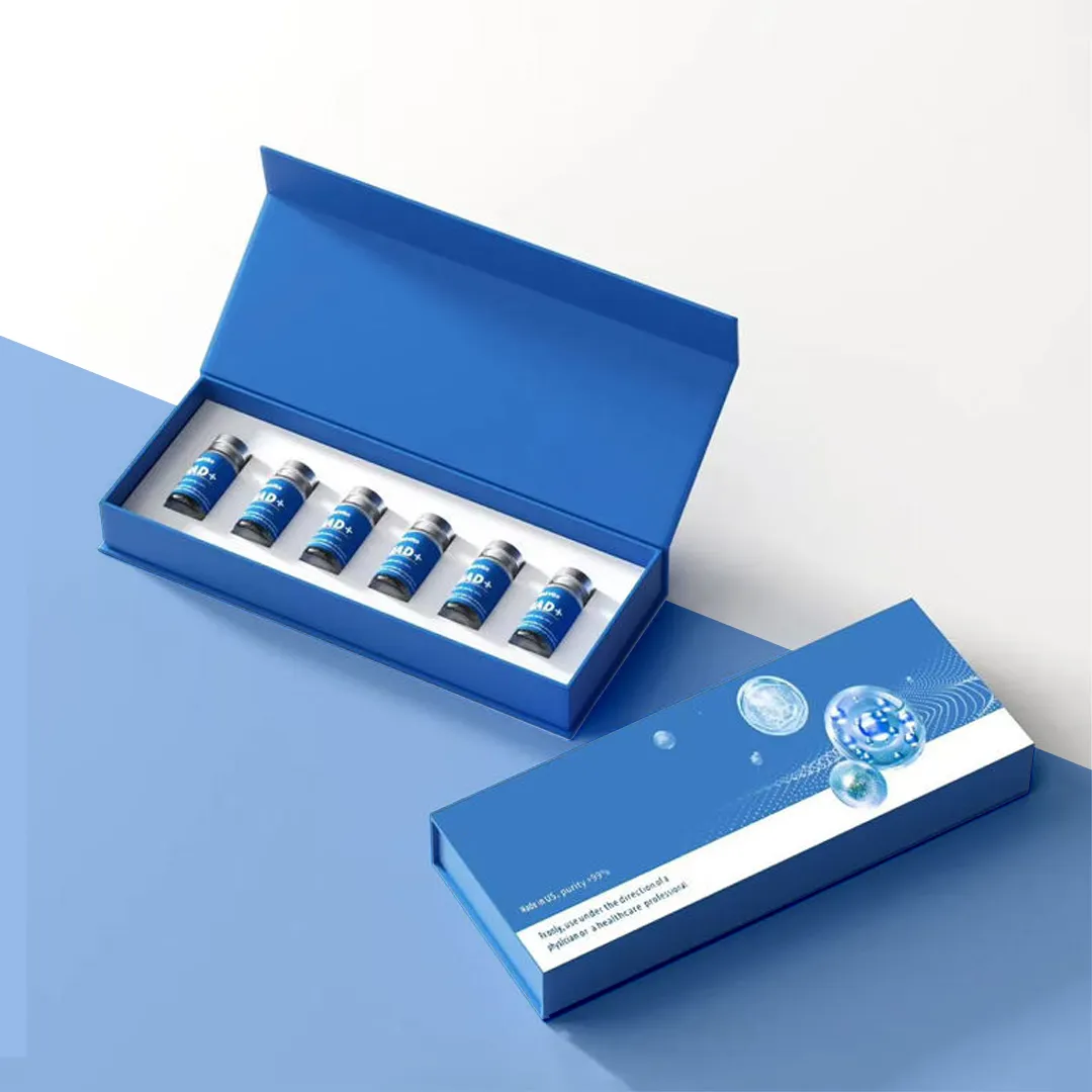 Blue magnetic presentation box holding six blue-capped vials in a row, shown with its printed sleeve