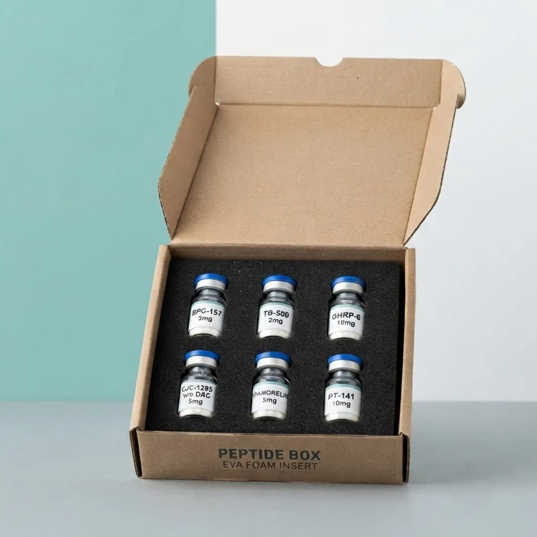 Kraft mailer box open showing six labelled vials seated in a black foam insert